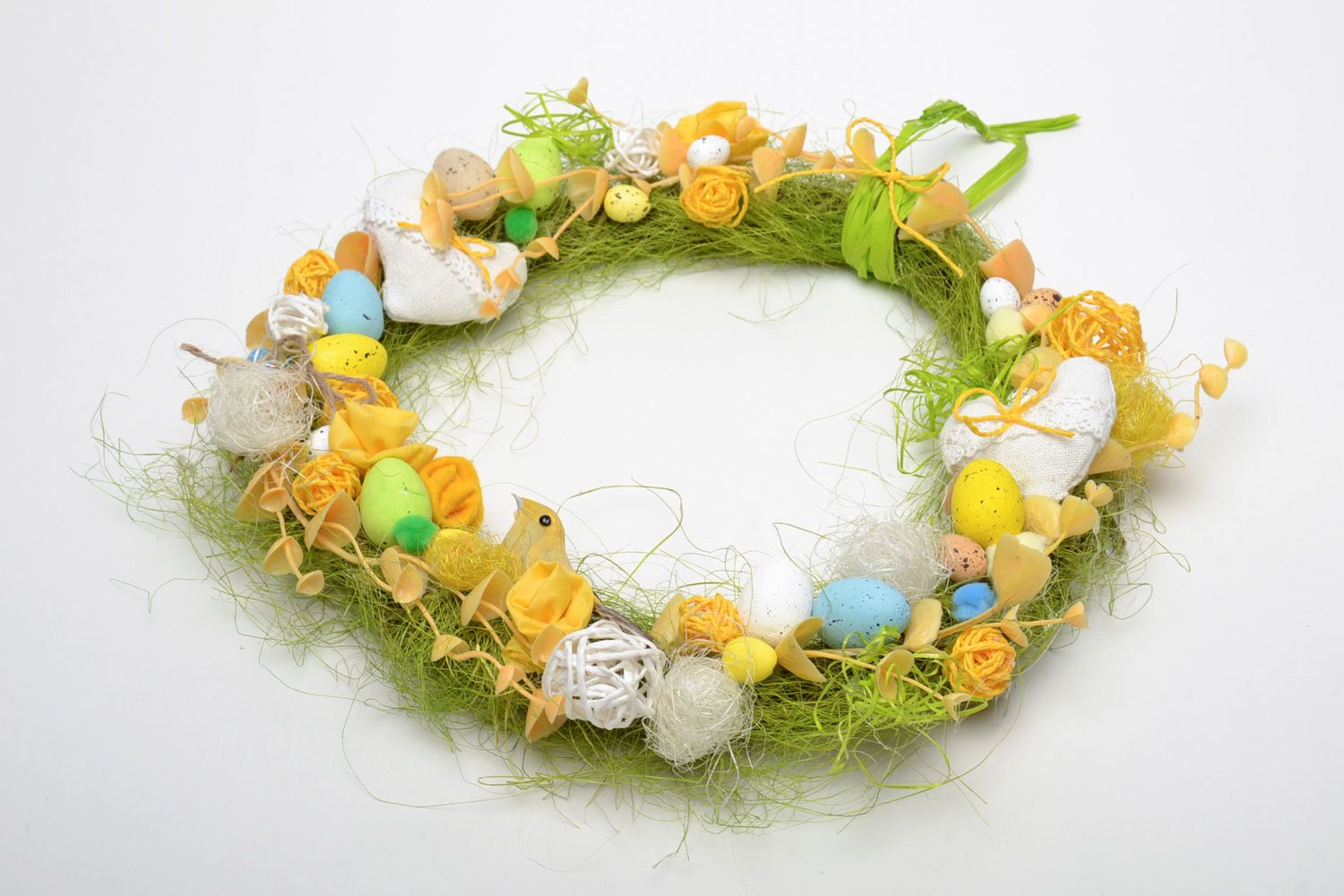 Handmade decorative Easter door wreath with little colorful eggs and feathers photo 2