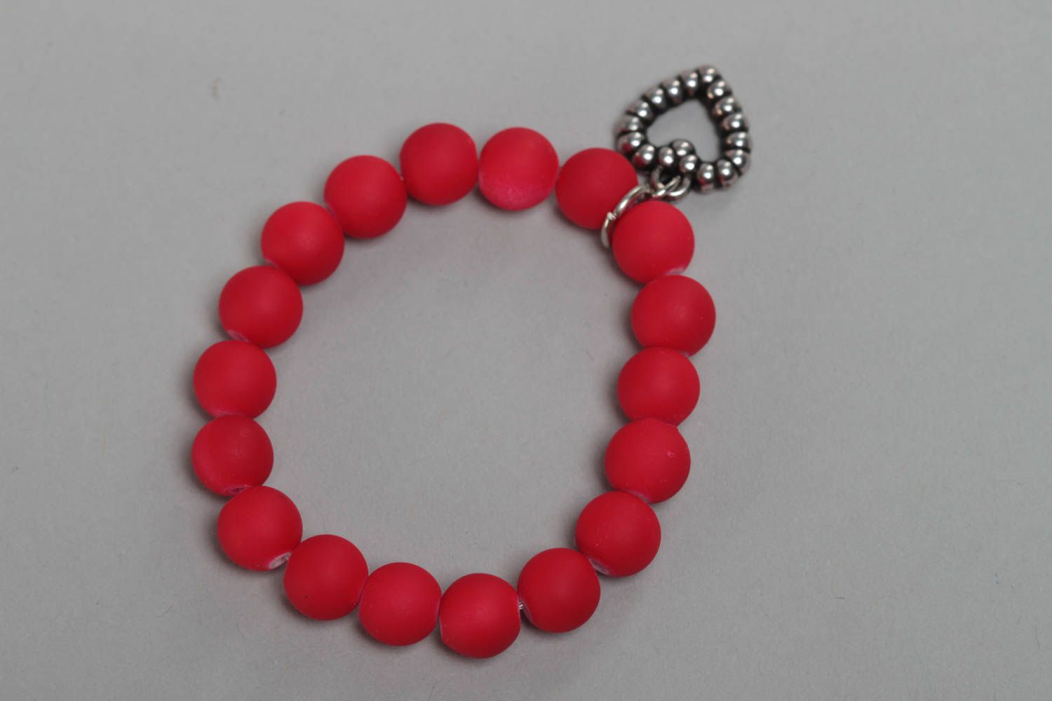 Red handmade children's wrist bracelet with plastic beads and heart charm photo 4