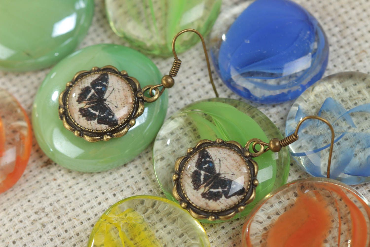Handmade round metal and glaze earrings with butterflies photo 1