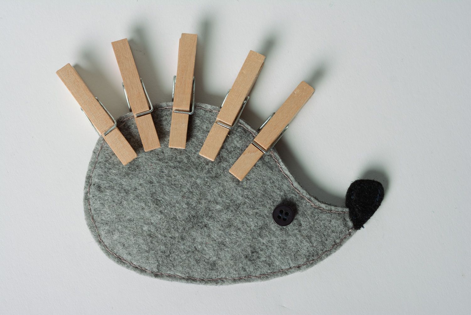 Handmade gray felt educational toy in the shape of hedgehog with clothes pins photo 2