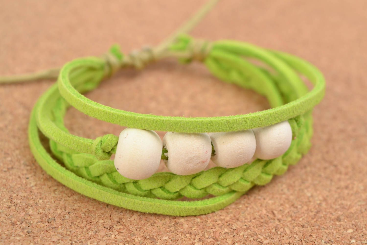 Handcrafted palegreen bracelet made of cotton threads interwined with wooden handmade beads photo 1
