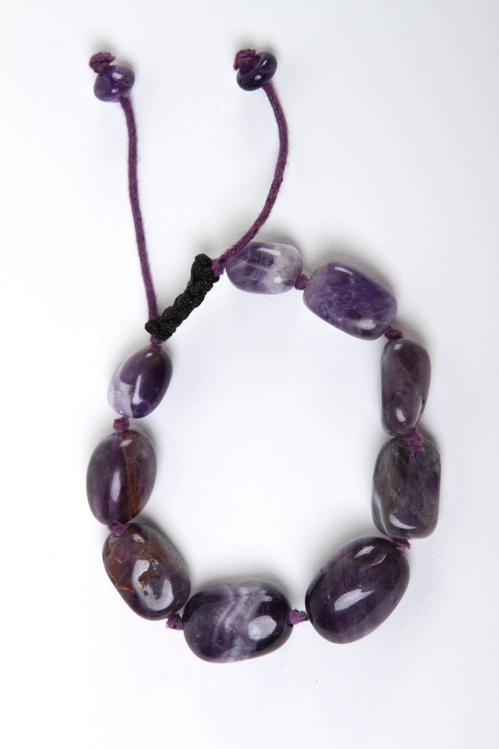 Strand bead gemstone bracelet with black cord and dark blue stone beads photo 2