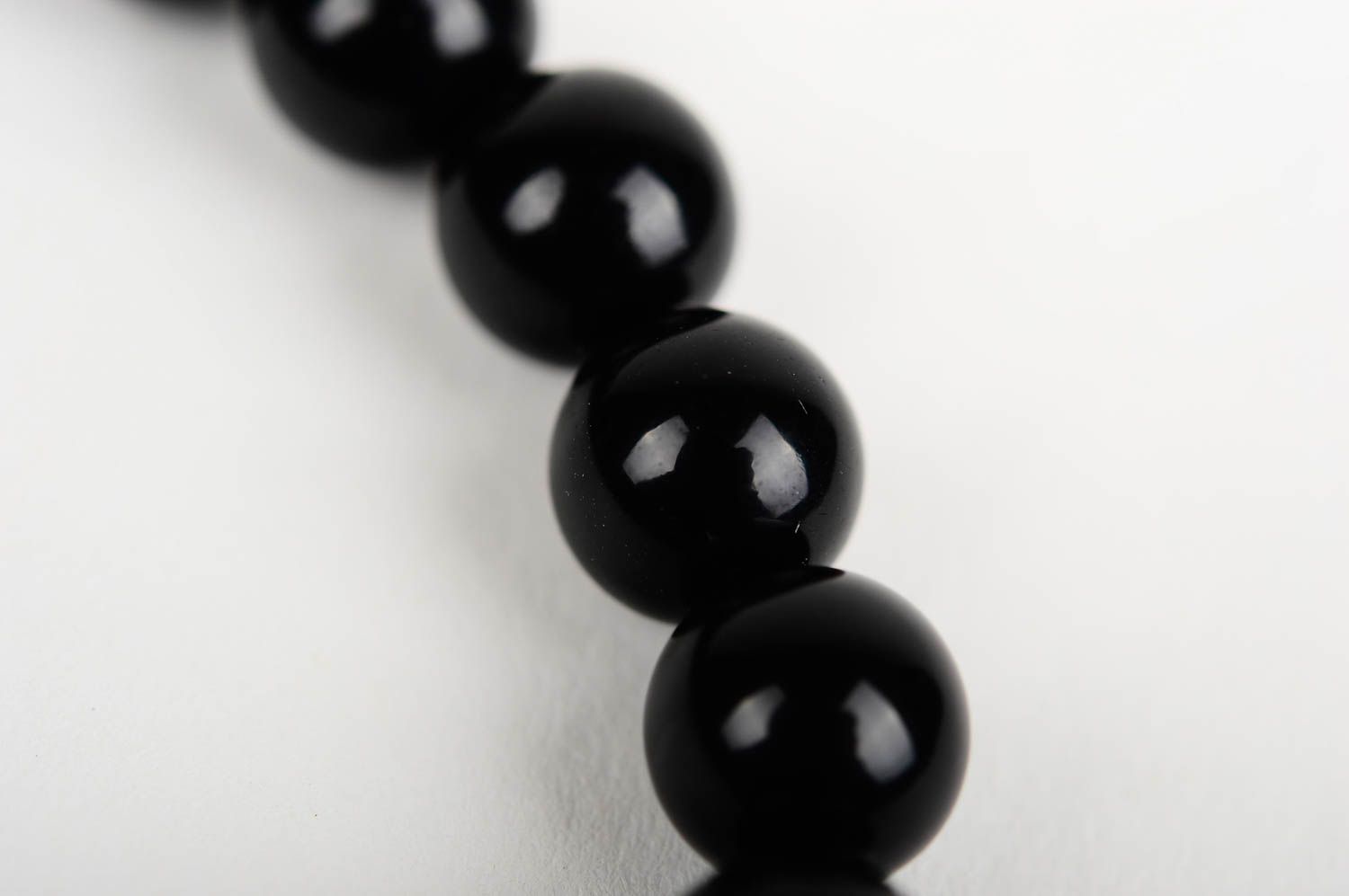Metal cross and black beads unisex bracelet on an elastic string photo 5