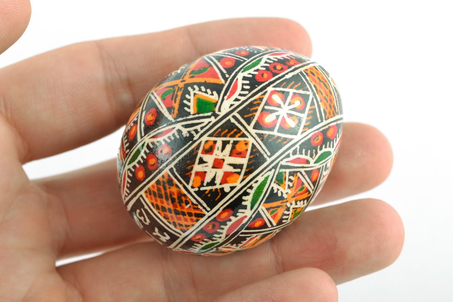 Beautiful handmade chicken egg painted with geometric ornament using wax technique  photo 2