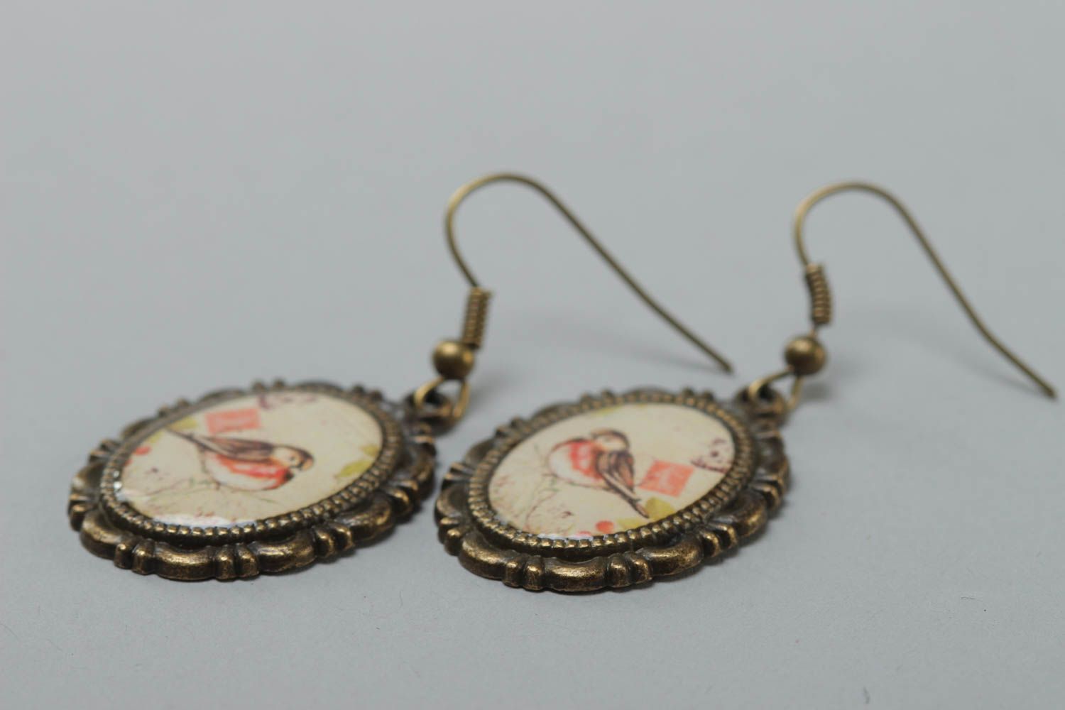 Handcrafted vintage oval earrings made of glass glaze with bullfinch prints on them photo 3