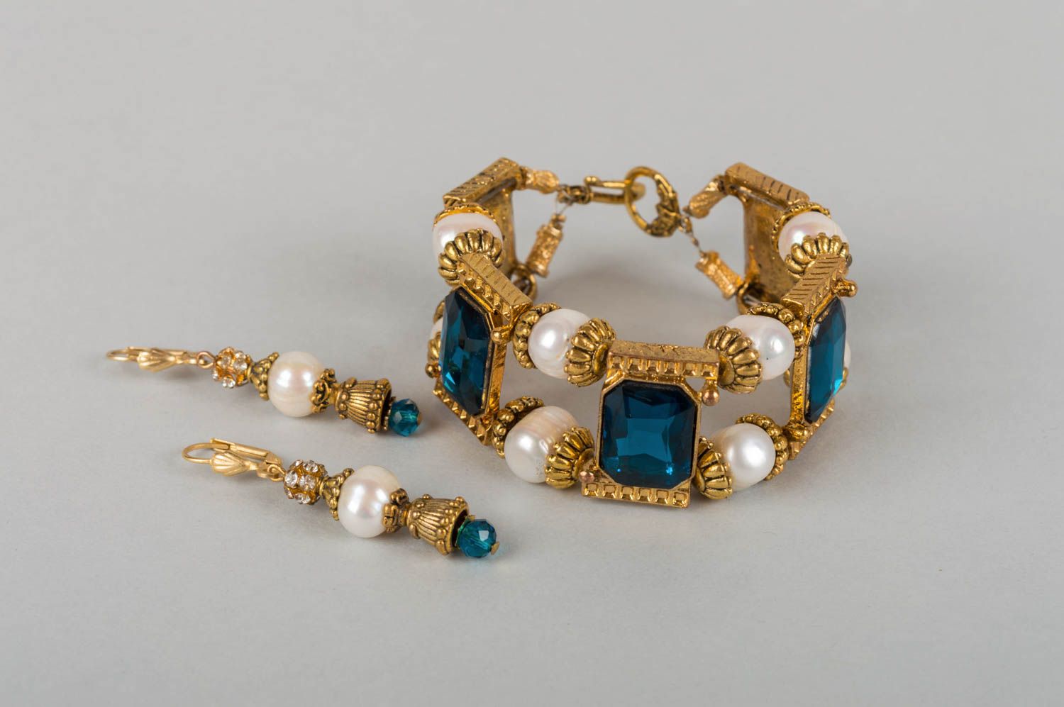 Set of jewelry made of brass earrings and bracelet with pearls and crystals photo 2