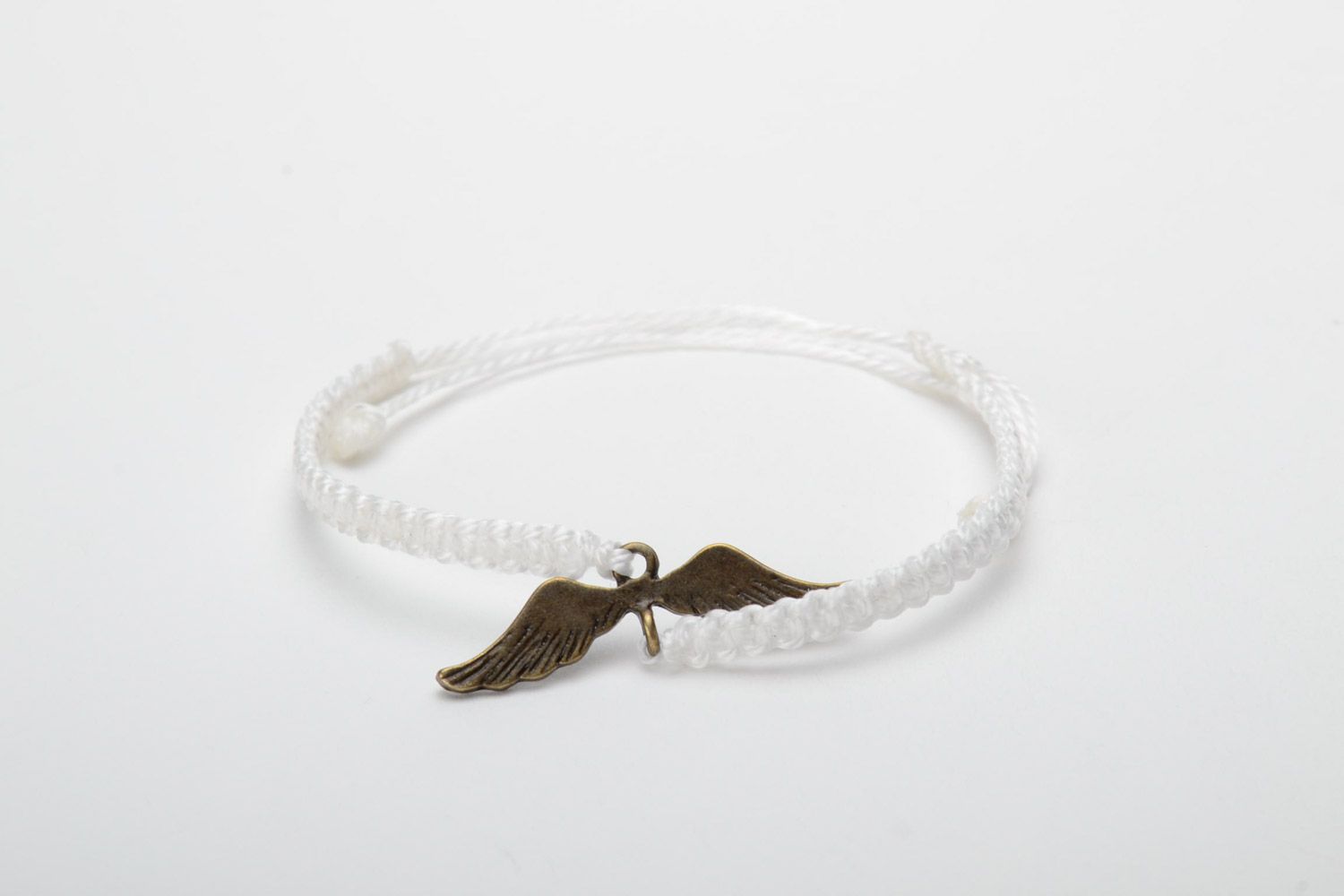 Handmade white women's woven thread bracelet with metal charm photo 5