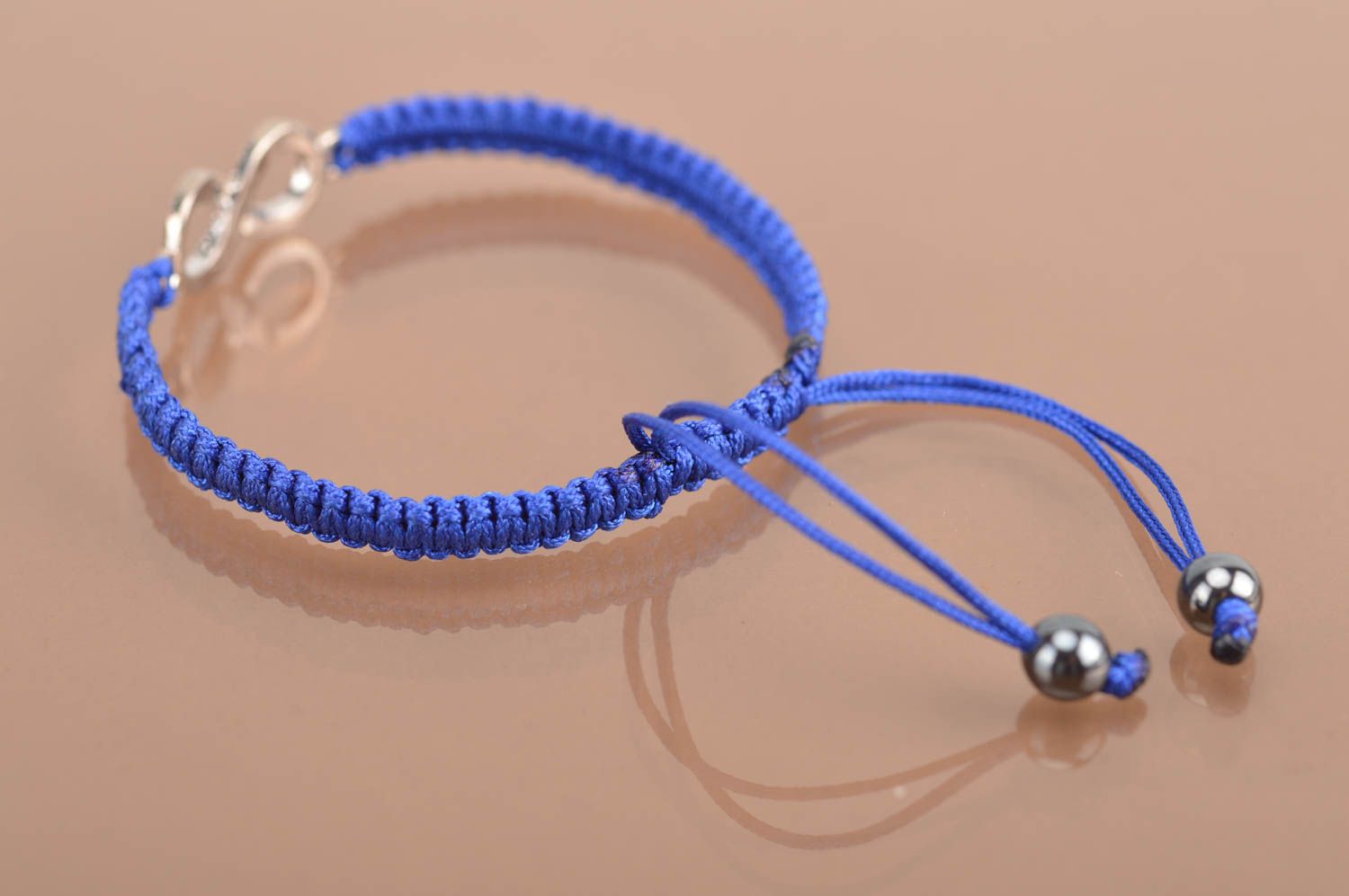 Handmade stylish thin blue woven wrist bracelet made of silk with insert photo 5