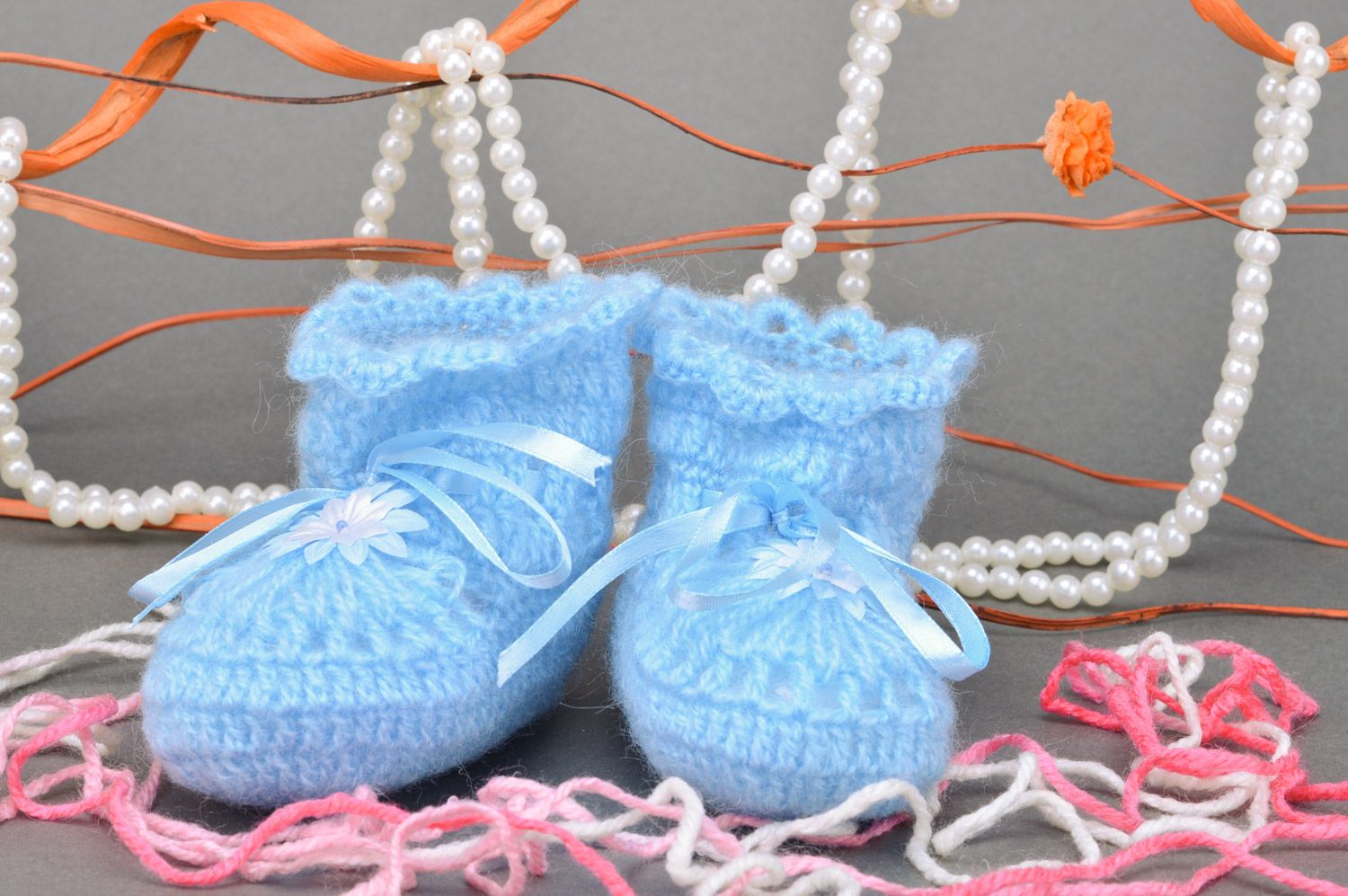 Handmade crocheted blue baby booties made of acrylic yarns with ribbon for a boy photo 1