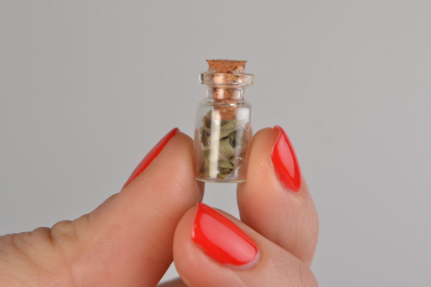 Unusual homemade neck pendant in the shape of glass flask with wormwood inside photo 2