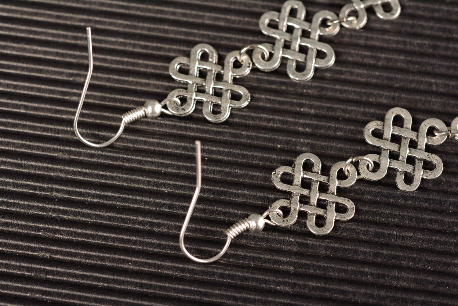 Handmade long designer metal dangle earrings of silver color in ethnic style photo 4
