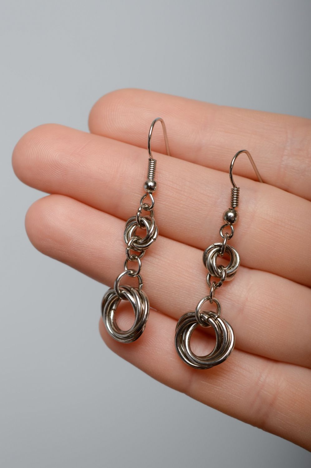 Handmade metal earrings created using chain armor weaving technique photo 3