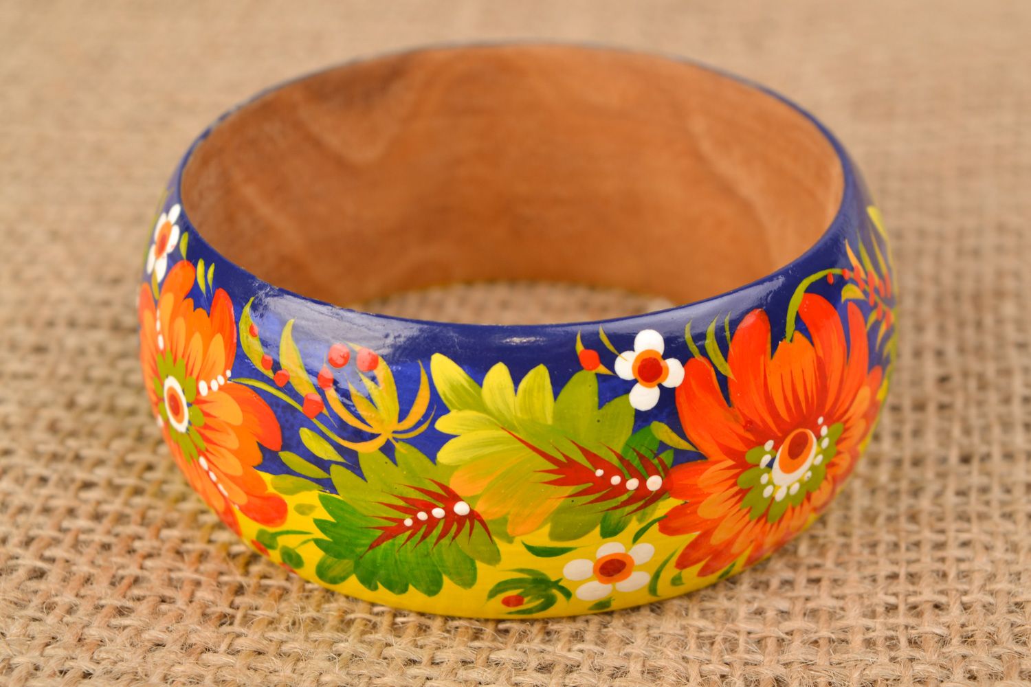 Handmade wooden wrist bracelet with traditional Petrikivka painting photo 1