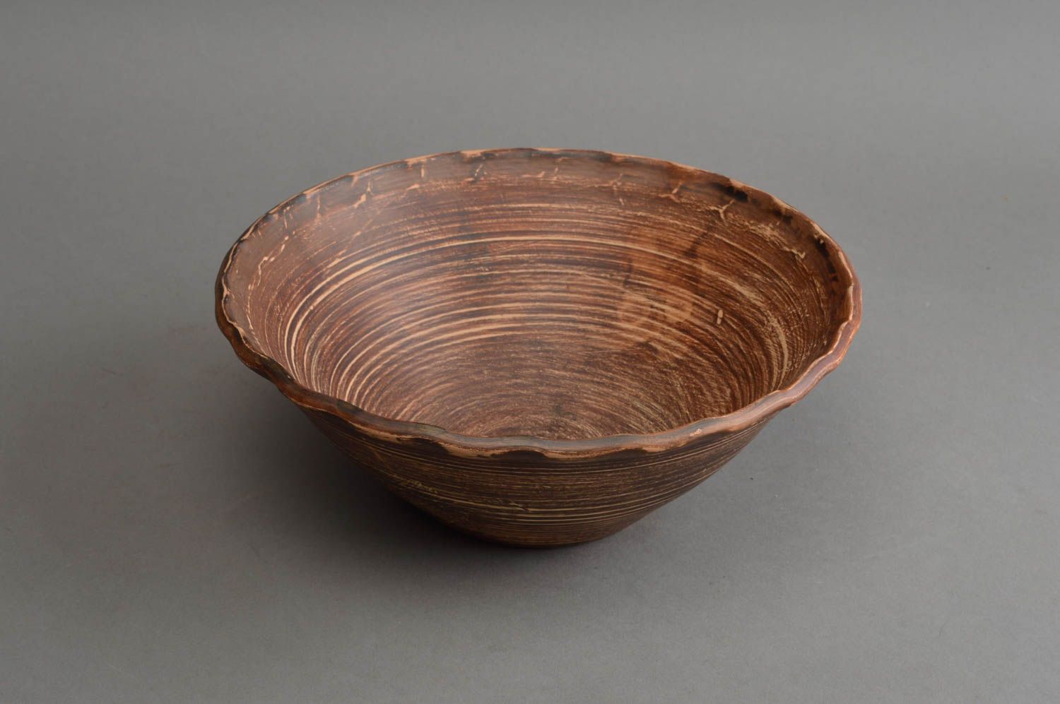 Handmade narrow brown salad bowl made of red clay using milk firing technique photo 3