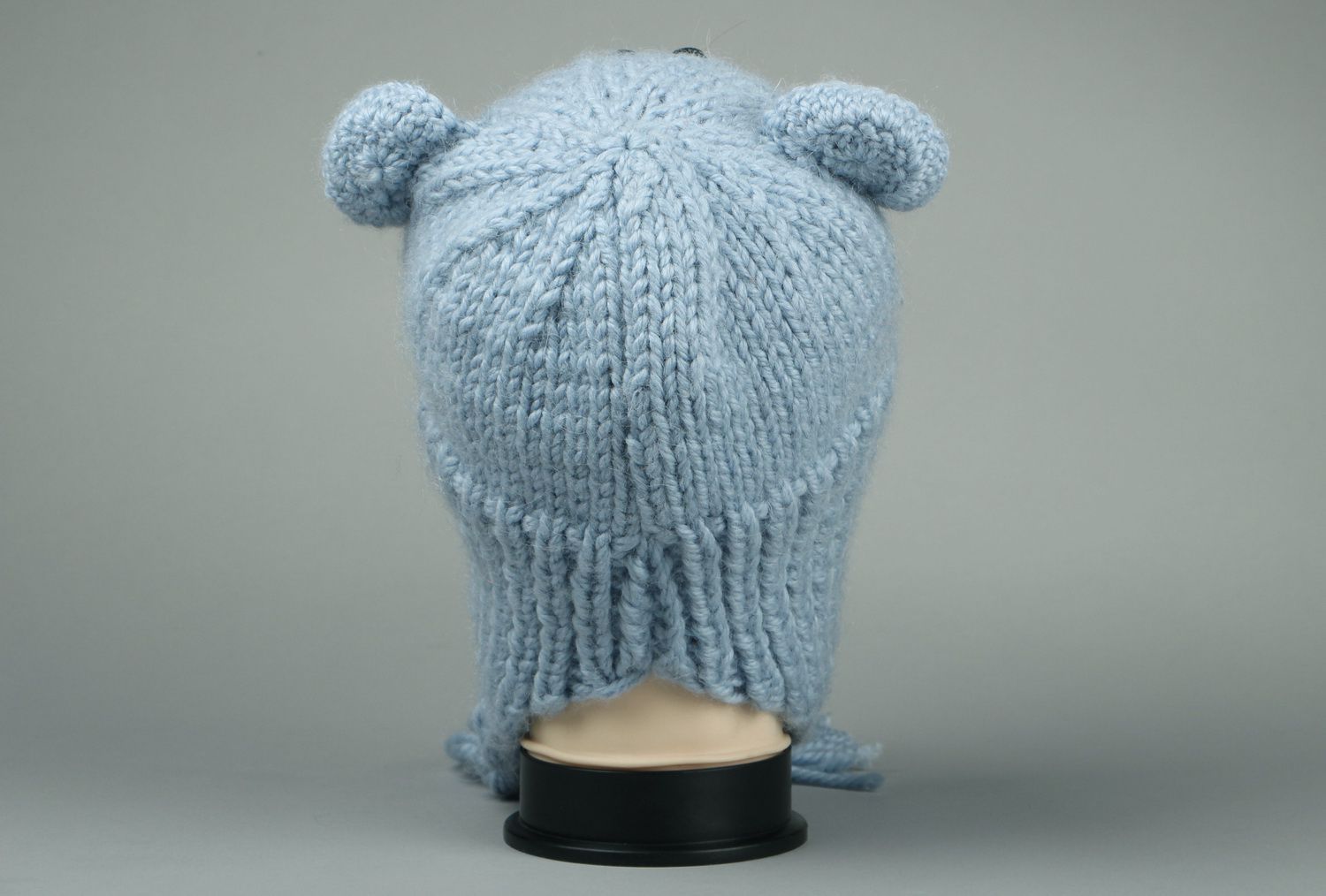Knitted earflap hat made of semi-wool photo 3