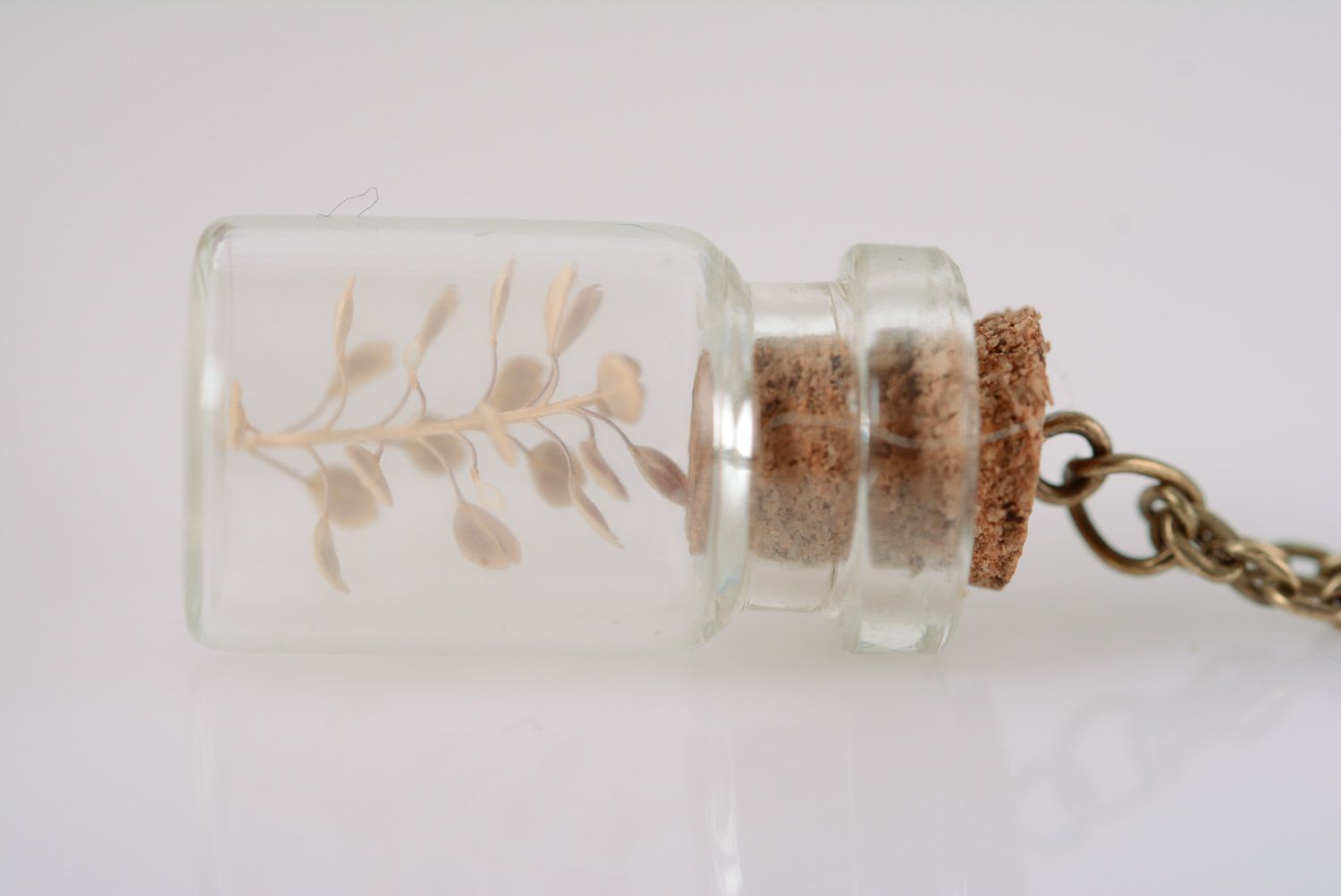 Handmade glass neck pendant in the shape of jar with plant inside with long chain photo 2