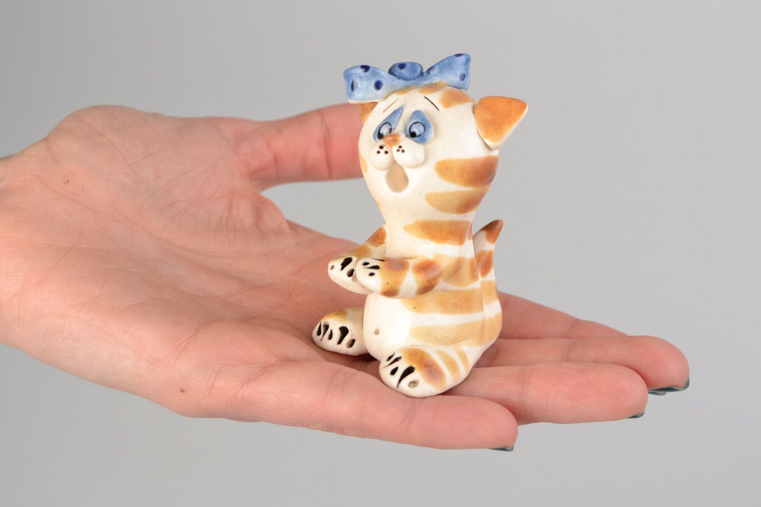 Handmade decorative miniature glazed ceramic figurine of kitten with blue bow photo 2