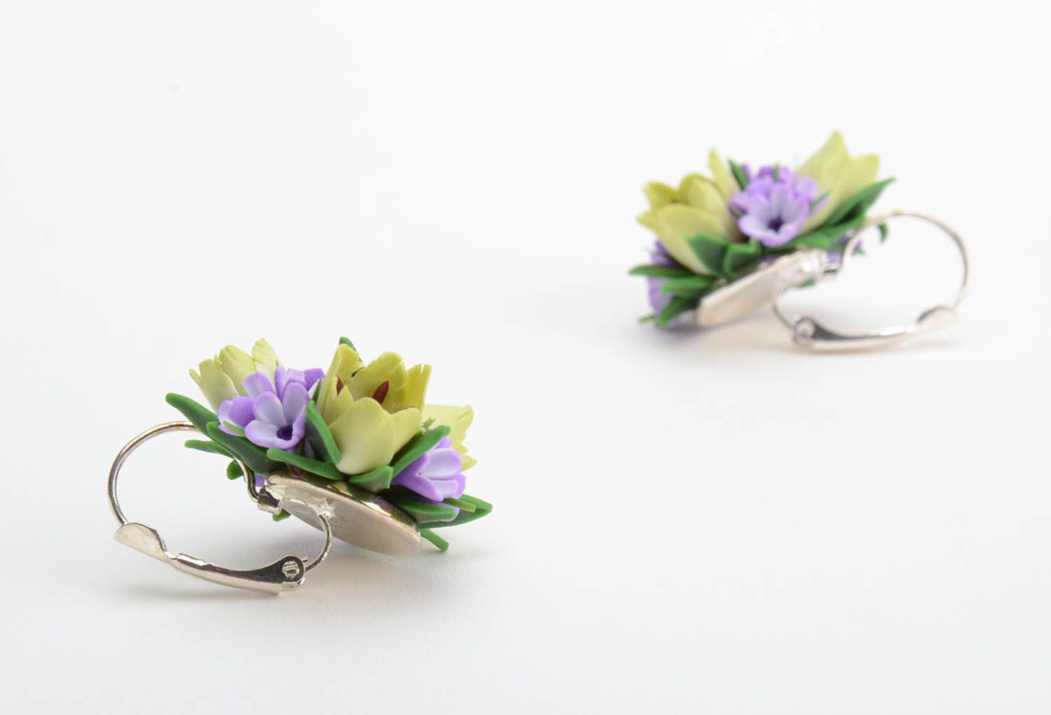 Handmade festive earrings with violet and green polymer clay floral compositions photo 5