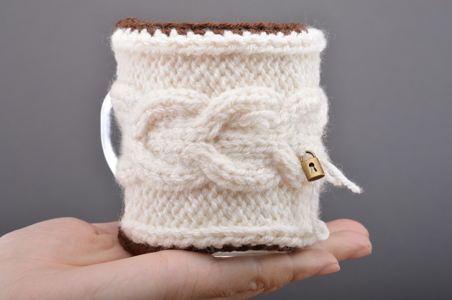 Cute handmade cup cozy knitted of white woolen threads with tiny metal lock photo 3