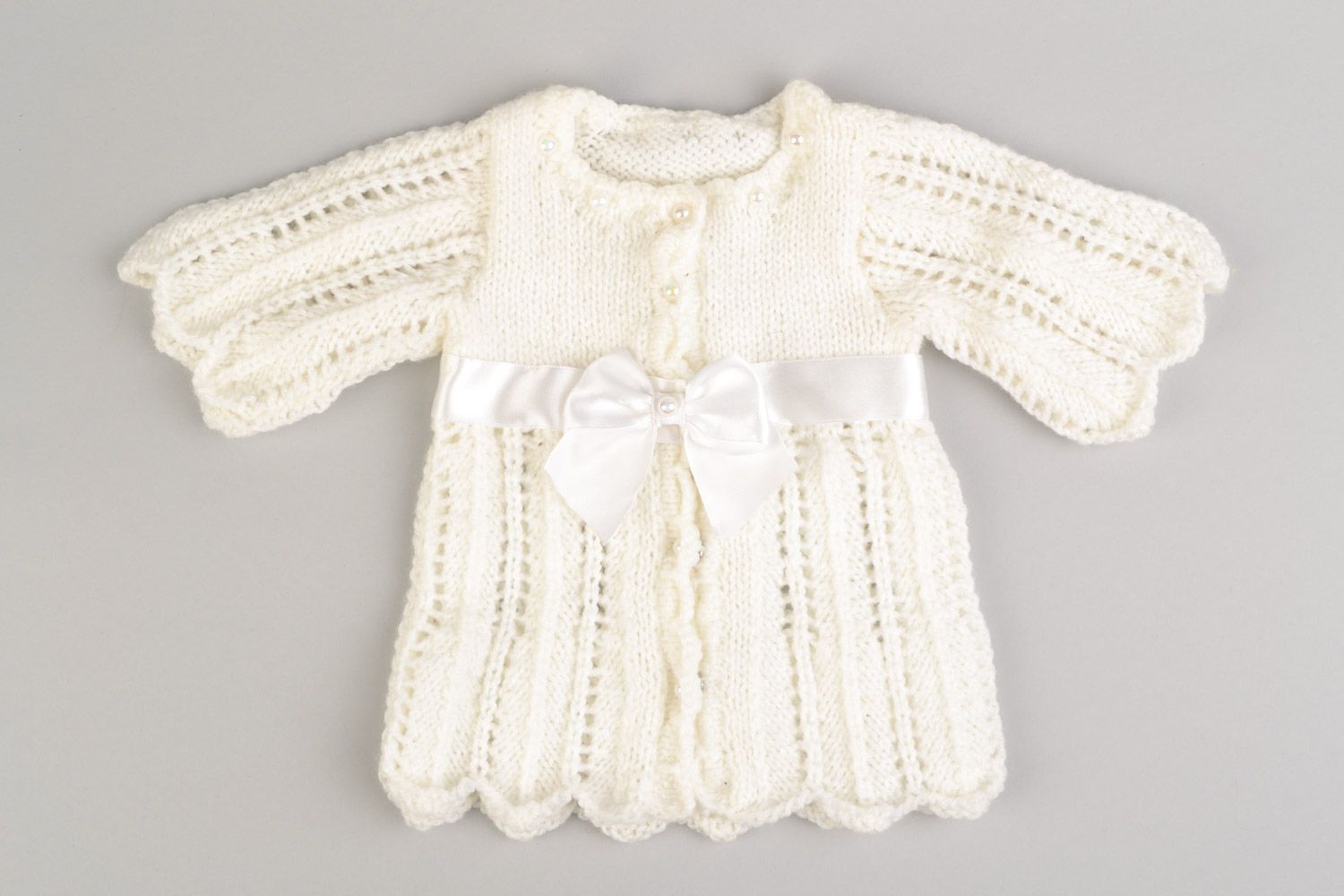 Knitted handmade white baby dress made of acrylic yarns with long sleeves  photo 1