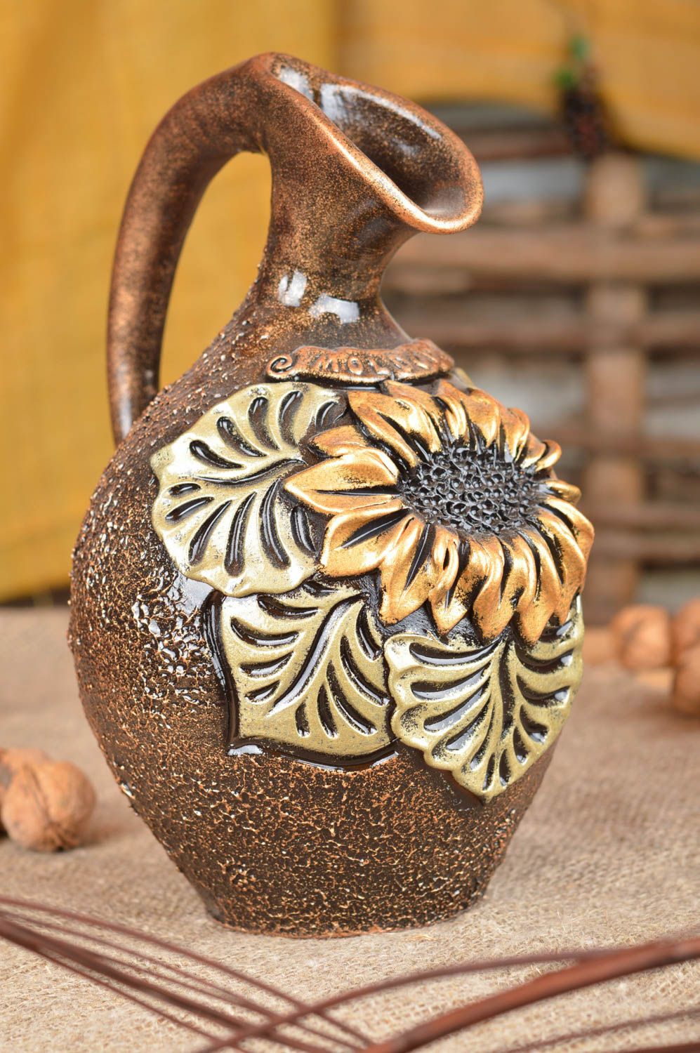 45 oz ceramic water jug with handle in a bronze color with sunflower molded décor 2,5 lb photo 1