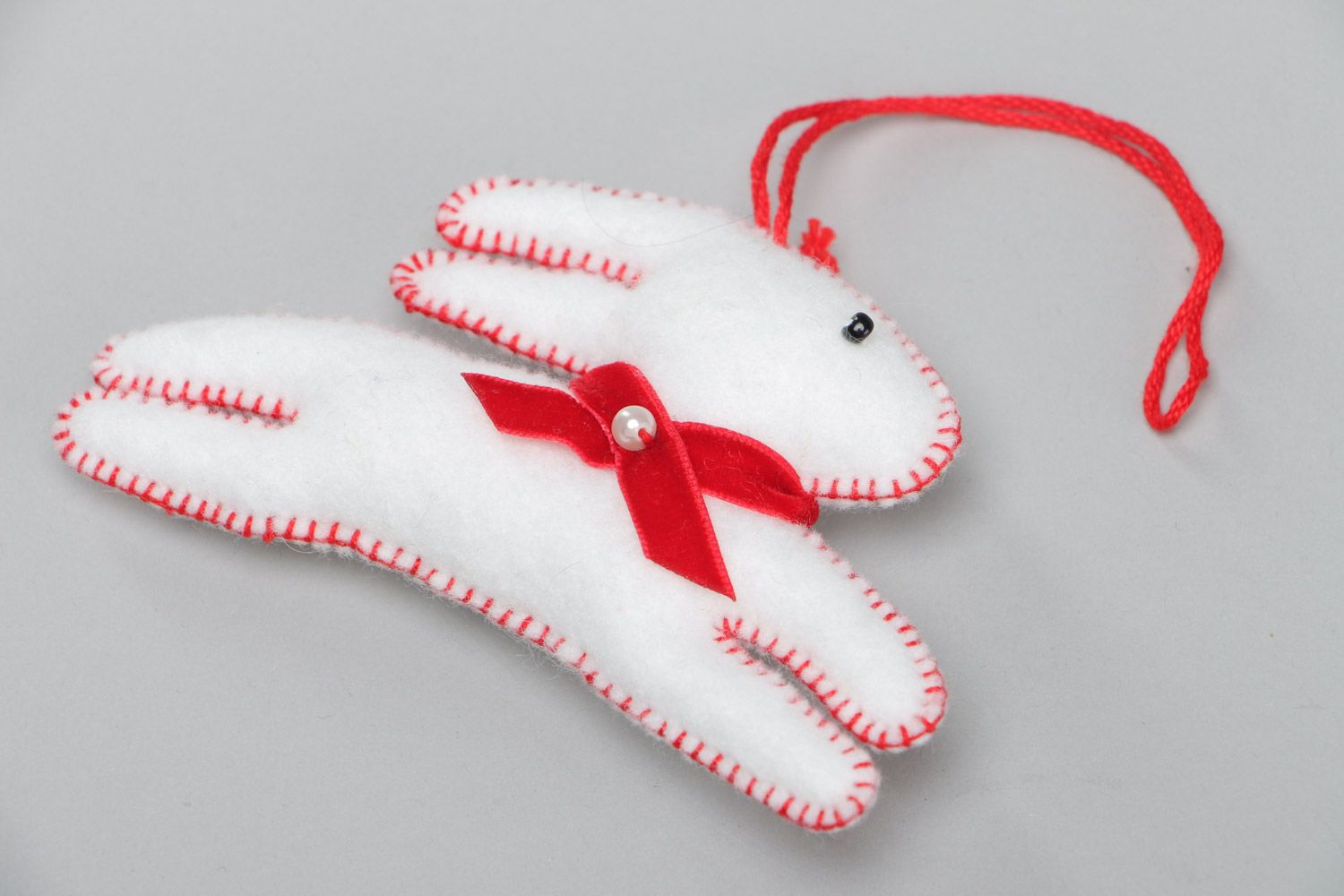 Handmade white decorative toy Rabbit sewn of felt with eyelet interior decoration photo 2