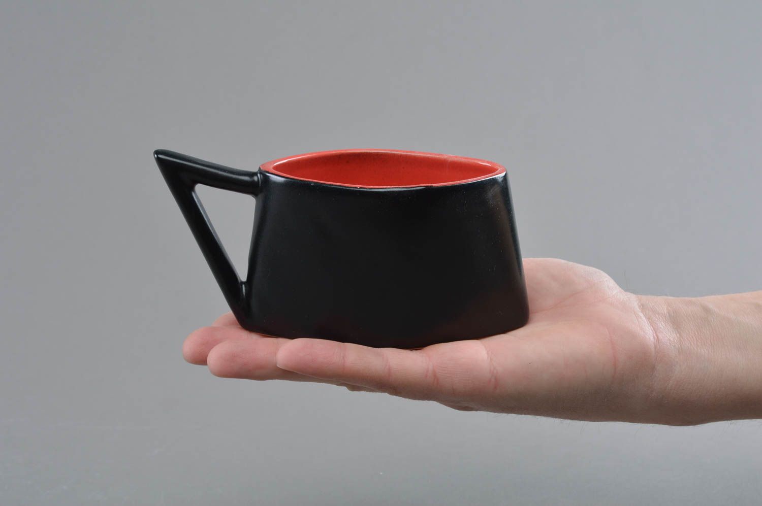 Unique art ceramic coffee cup in red and black color with triangle handle photo 4