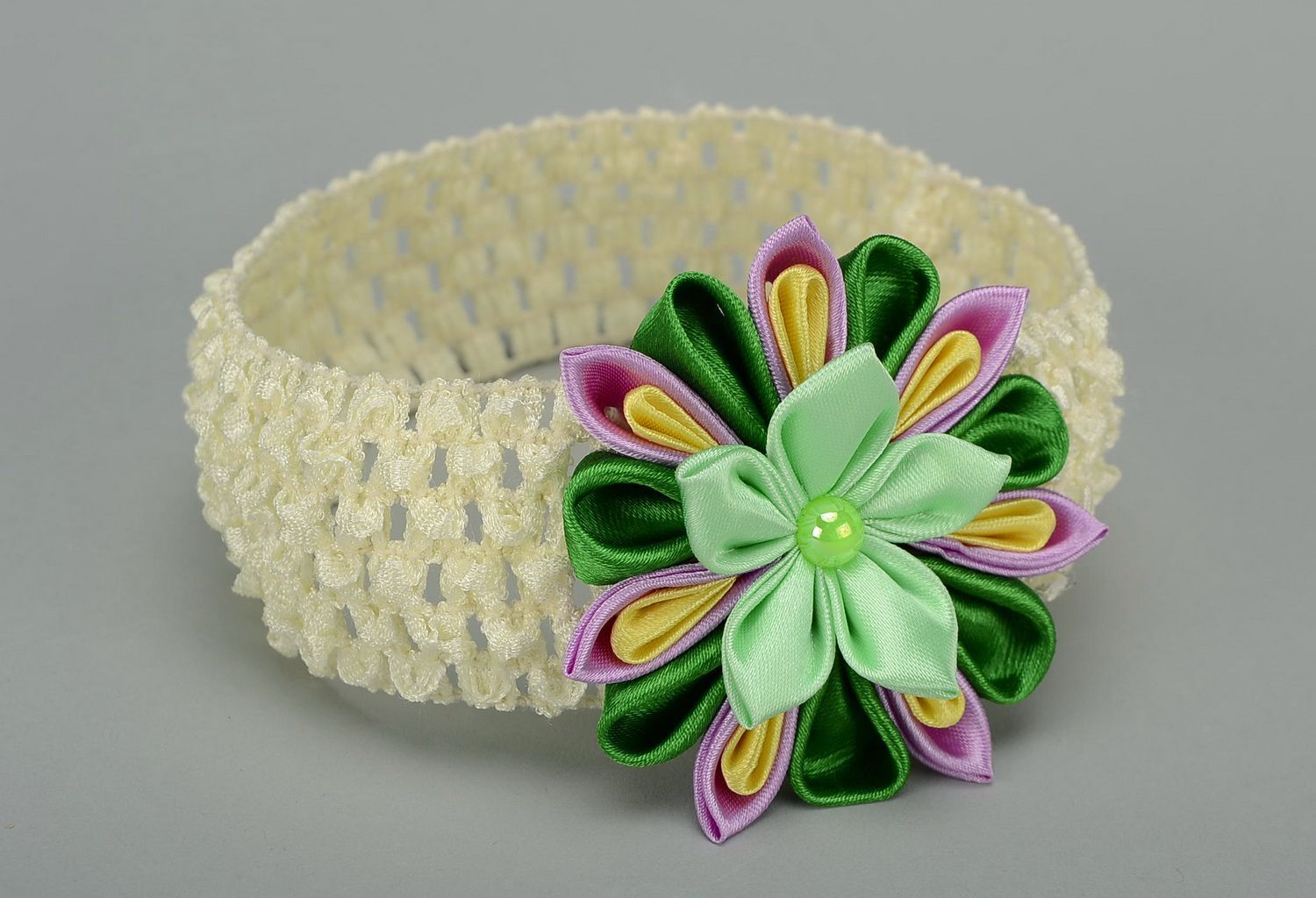 Elastic headband with flower photo 1