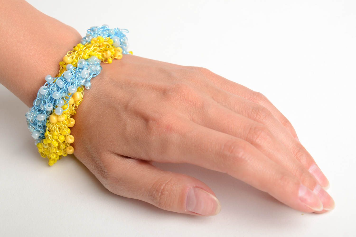 Bright handmade woven wrist bracelet crocheted of blue and yellow Czech beads photo 2