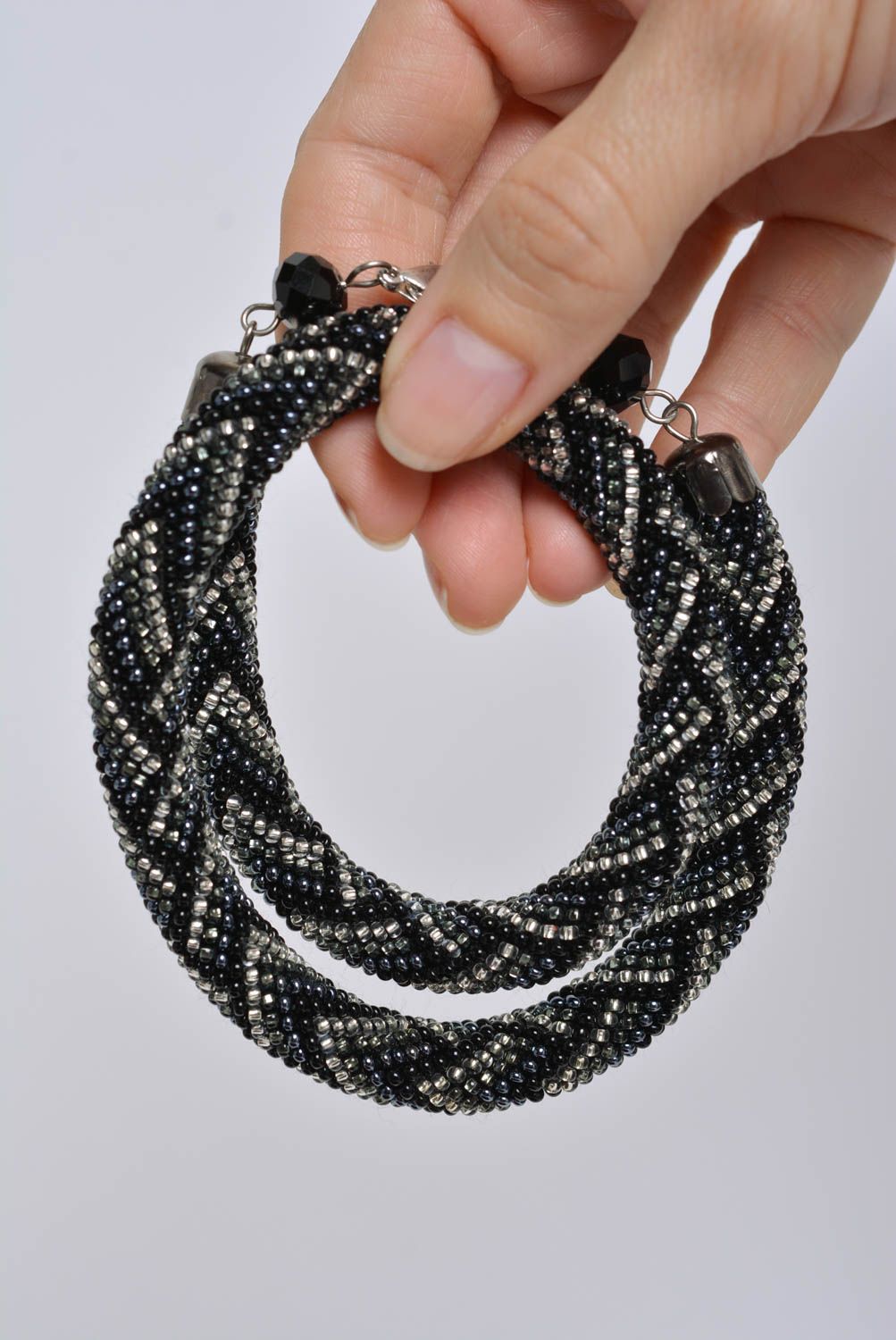 Handmade designer bead woven cord necklace with laconic dark geometric ornament photo 3