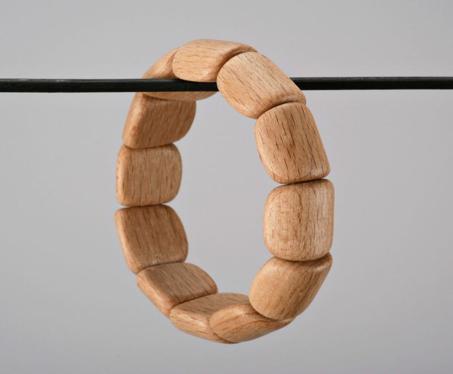 Light wooden bracelet on elastic band photo 3