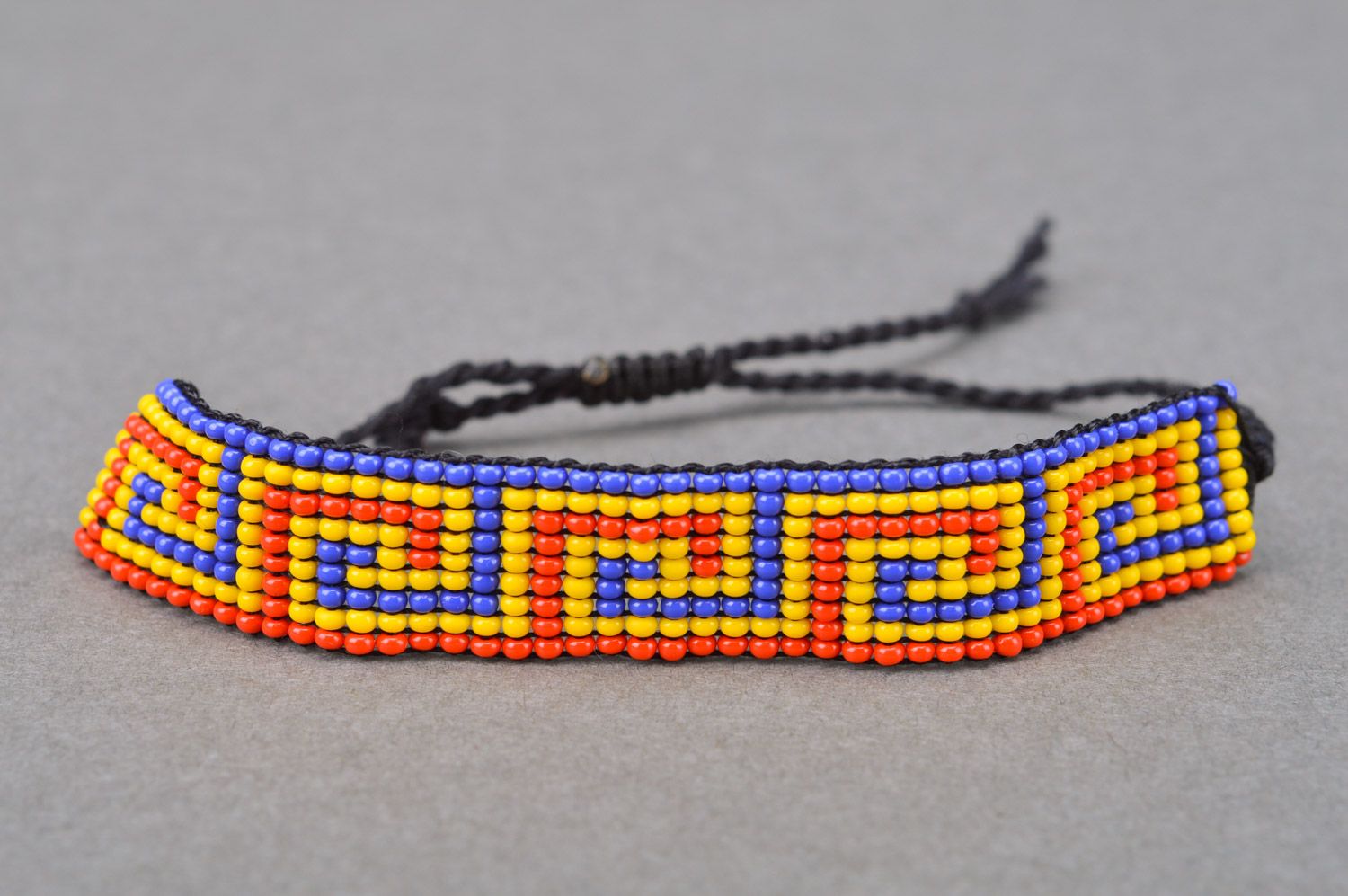 Three-colored wide handmade beaded wrist bracelet with ties photo 2