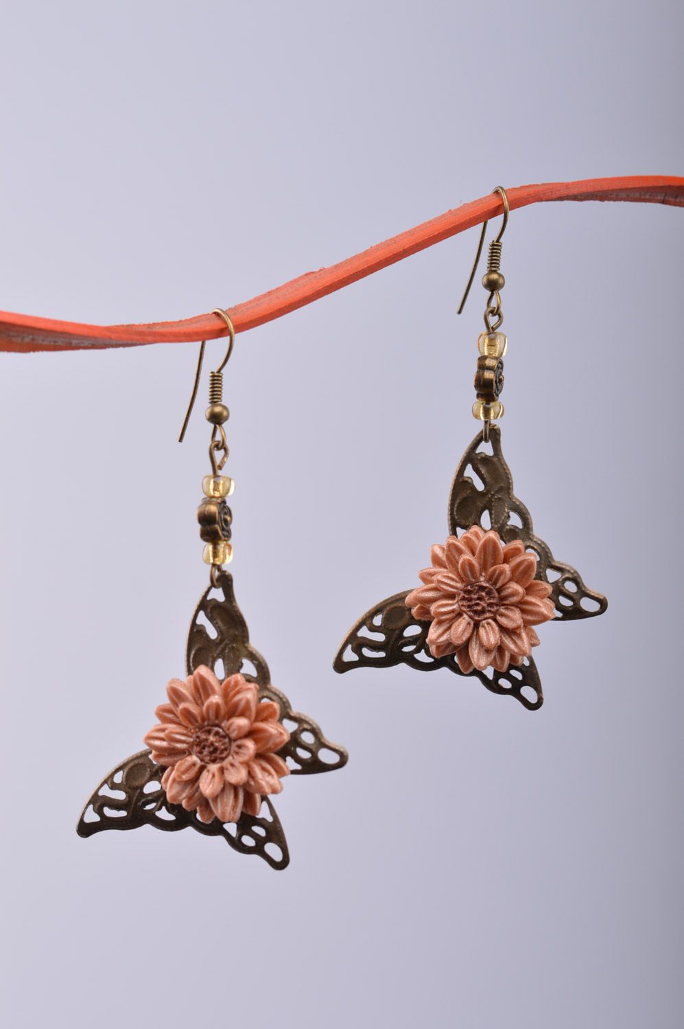 Dangle earrings hand made of metal and polymer clay in the shape of butterflies and flowers photo 3