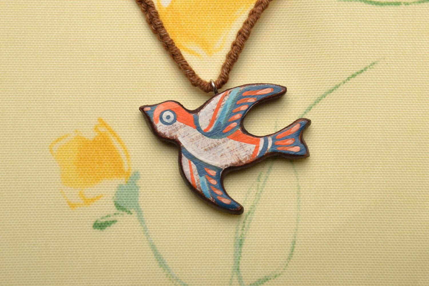 Wooden pendant in the shape of bird photo 1