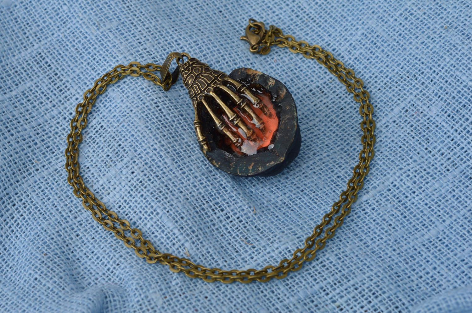 Luminous cute handmade pendant made of nut with metal hand Hand on heart photo 2