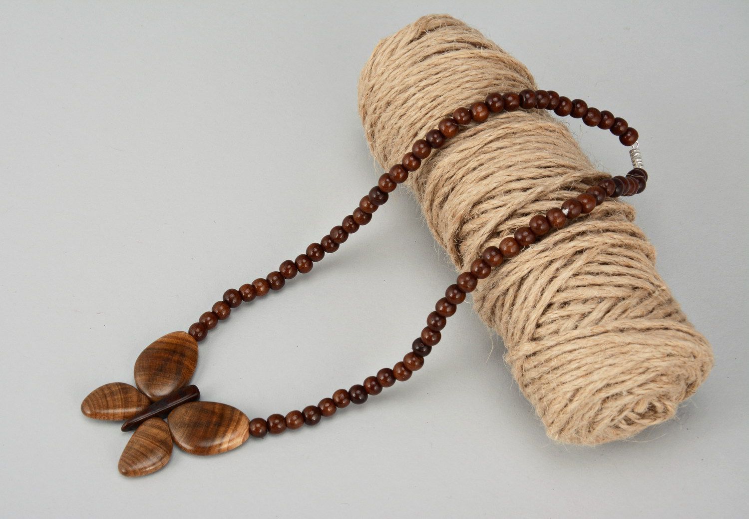 Wooden bead necklace with butterfly photo 1