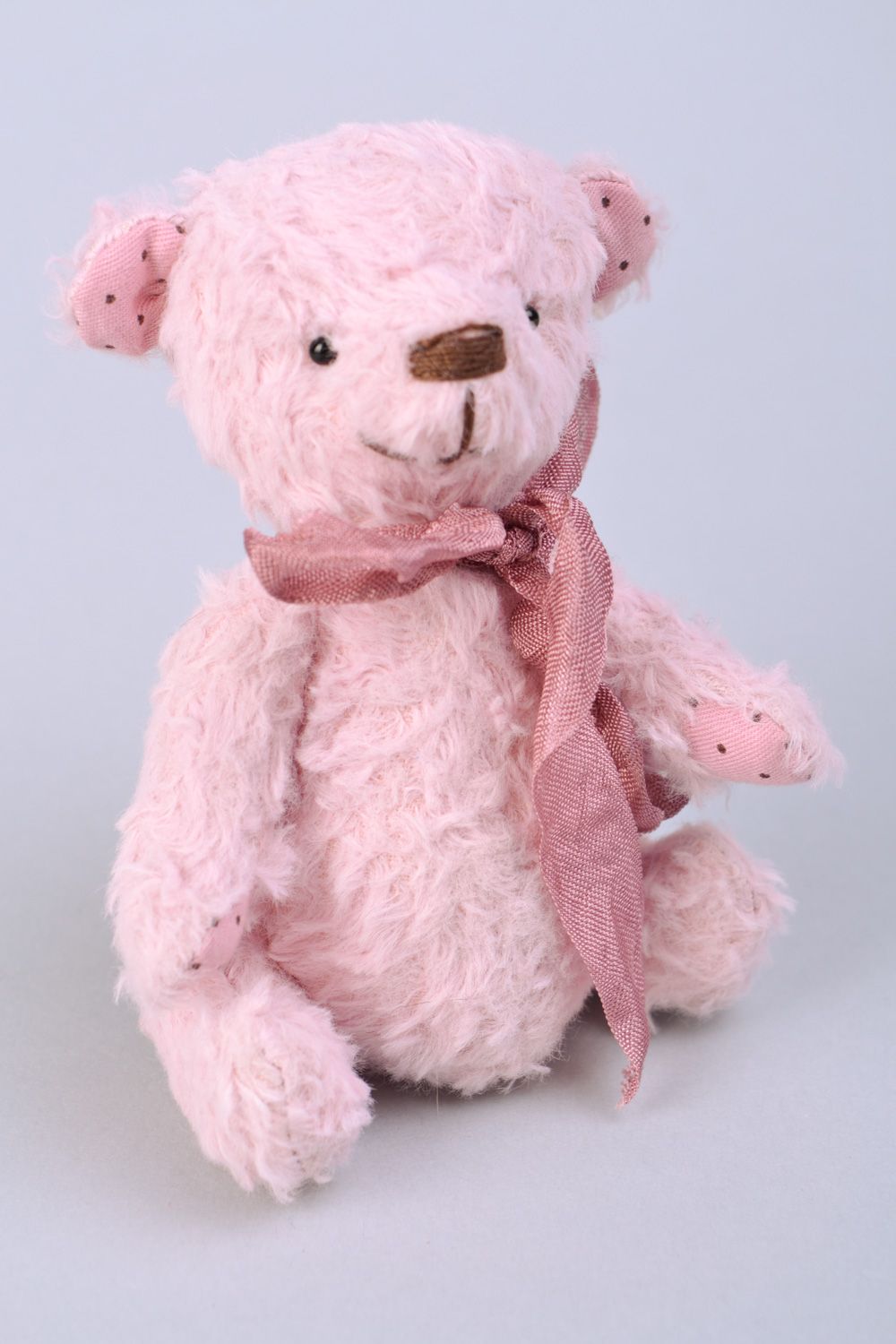 Small handmade designer soft toy bear of pink color with beautiful bow photo 1