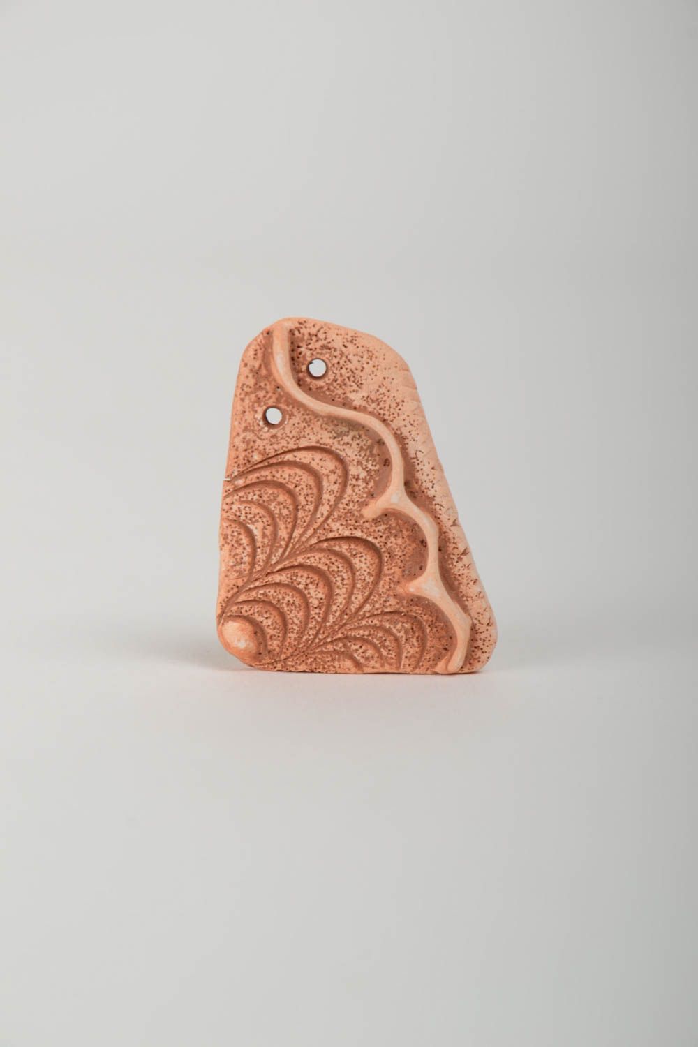 Handmade decorative flat ceramic blank pendant with wave shaped pattern photo 2