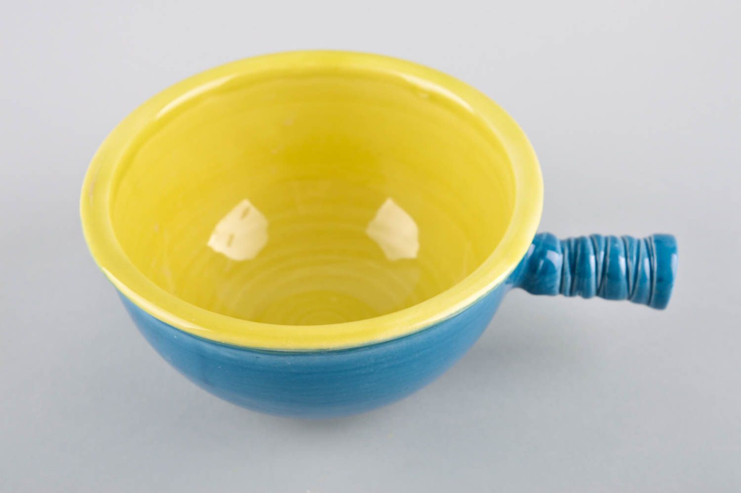Ceramic blue and yellow color ceramic cup for kids with stick handle photo 2