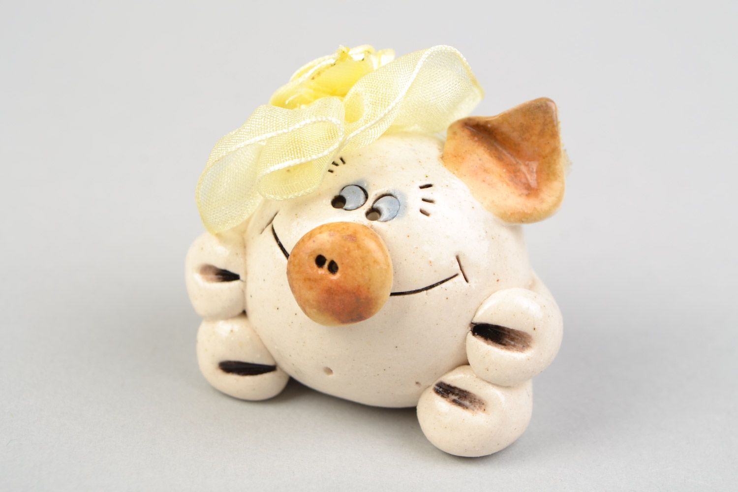 Handmade miniature ceramic figurine of funny fat pig painted with glaze photo 1