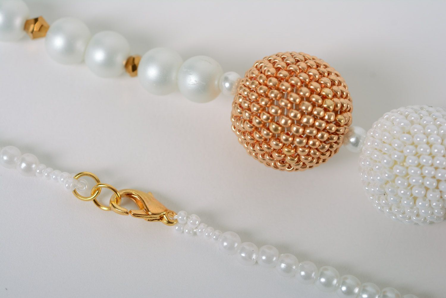 Tender handmade necklace with five balls woven of white and golden beads  photo 4