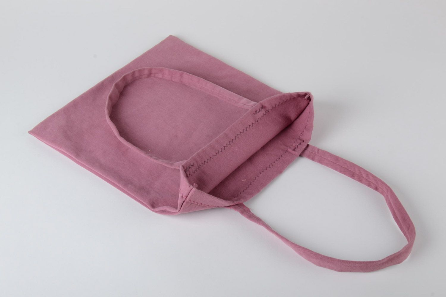 Bolso textil artesanal de tela rosada con aplicación grande  foto 5
