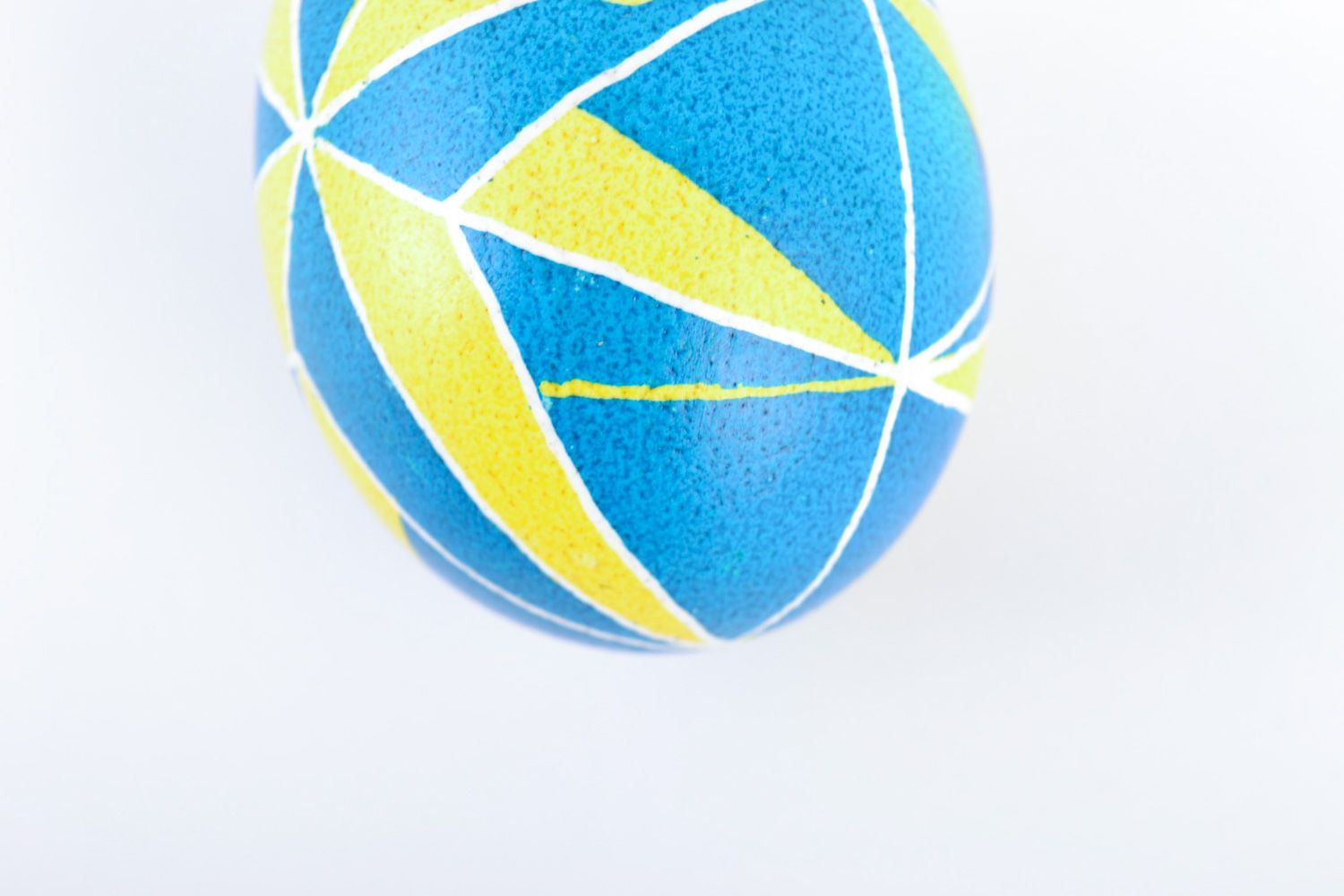 Easter souvenir chicken egg painted with acrylic in blue and yellow colors photo 4