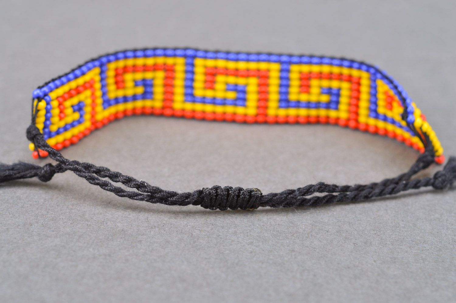 Three-colored wide handmade beaded wrist bracelet with ties photo 5