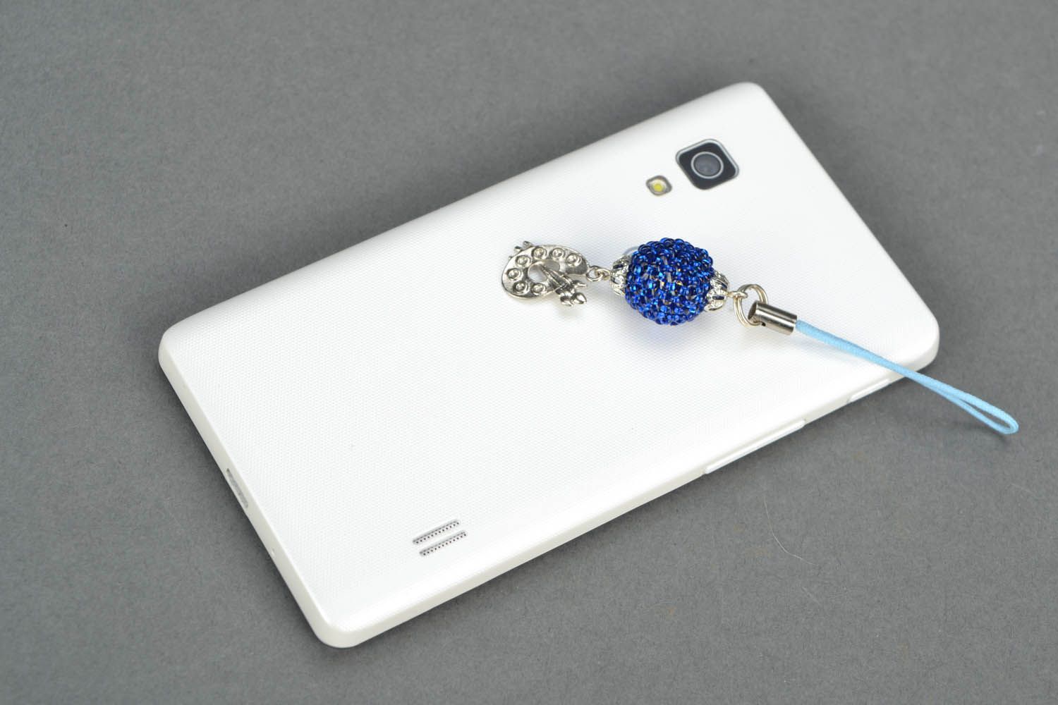 Cell phone charm of blue color photo 1