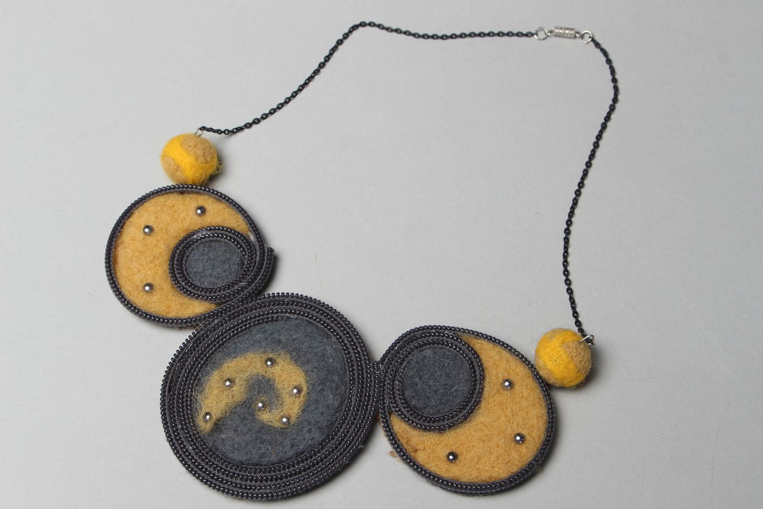 Handmade felt necklace with zippers photo 1