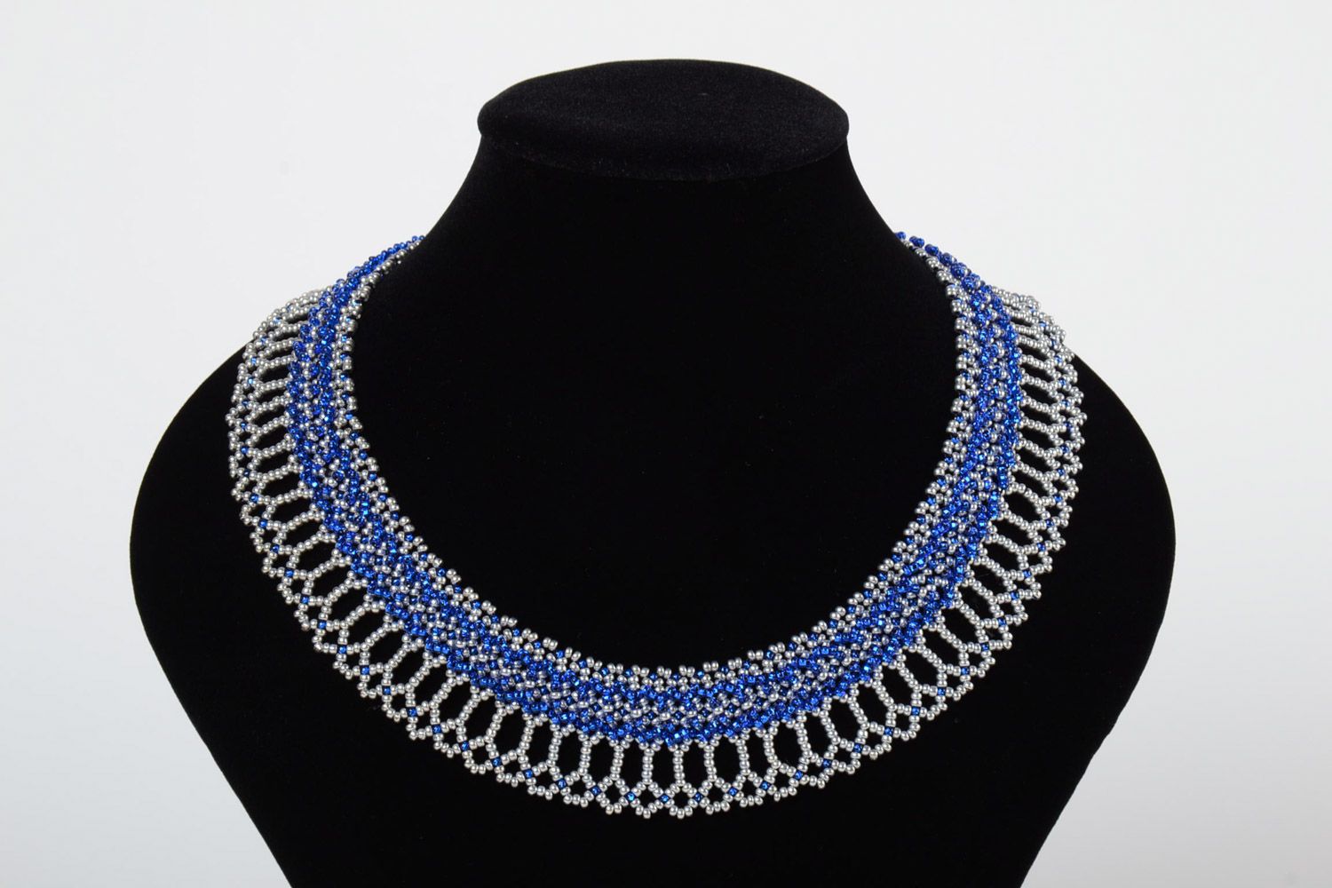 Beautiful lacy handmade women's beaded necklace of blue and white colors photo 1