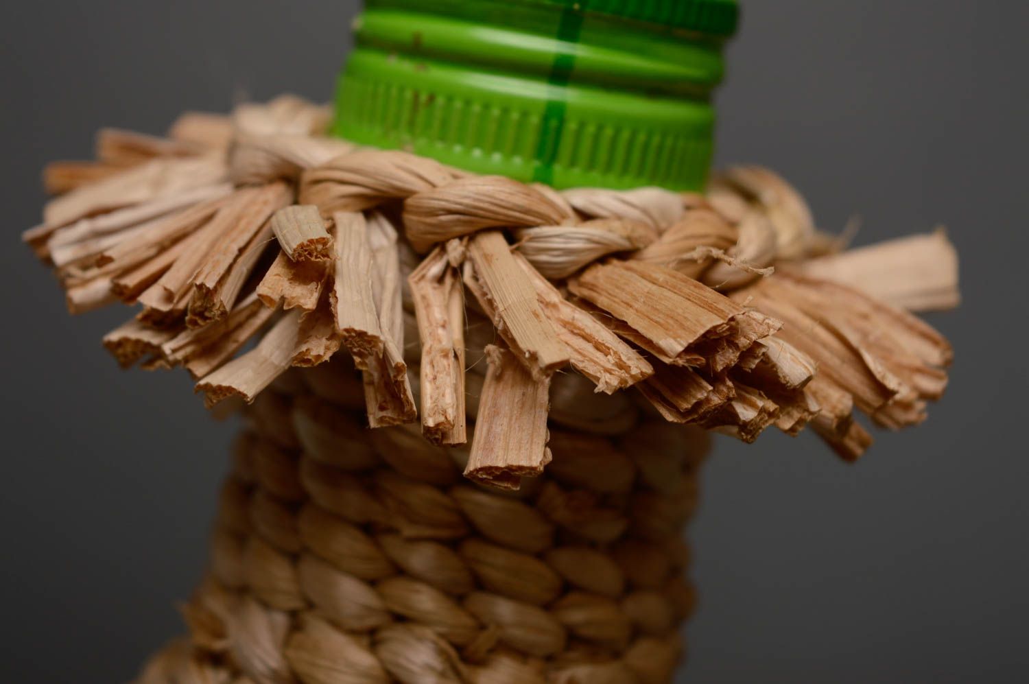 Handmade bottle woven over with reedmace photo 3