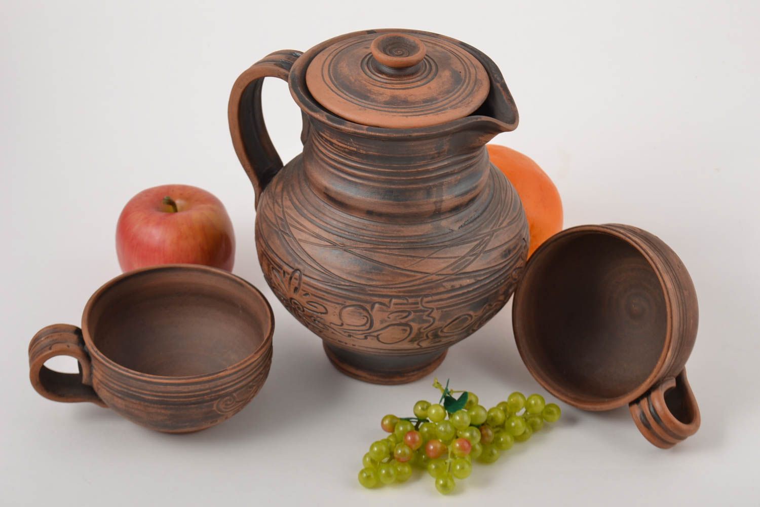 Jarro de cerámica y tazas artesanales vajilla de barro estilosa orgánica foto 1