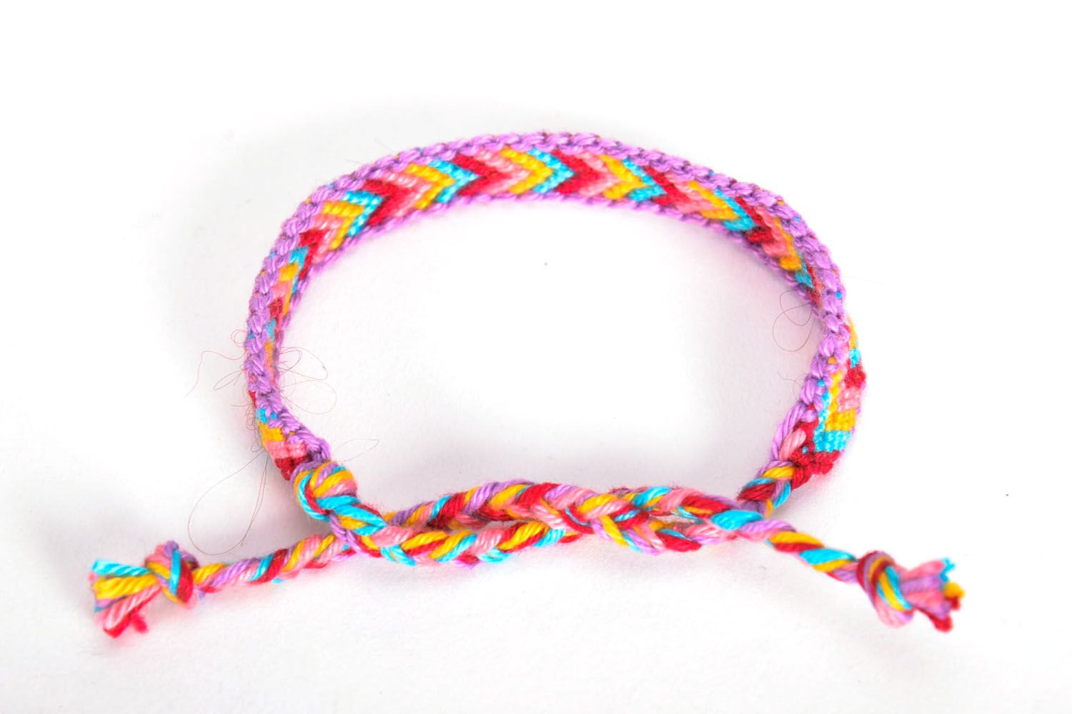Bracelet tressé en fils multicolores fait main photo 4